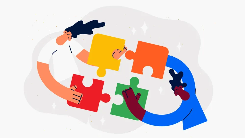 Imagen de dos señores haciendo un rompecabezas